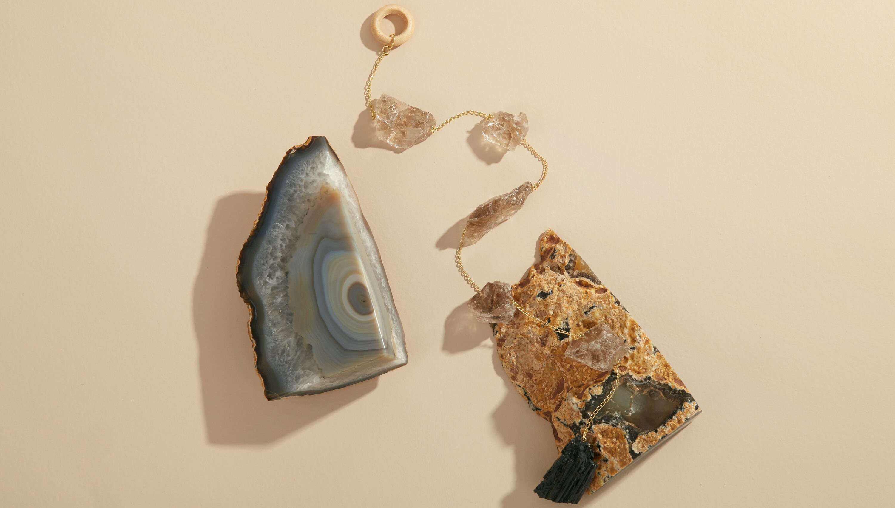 Natural agate bookends and a smoky quartz wall hanging creating sanctuary