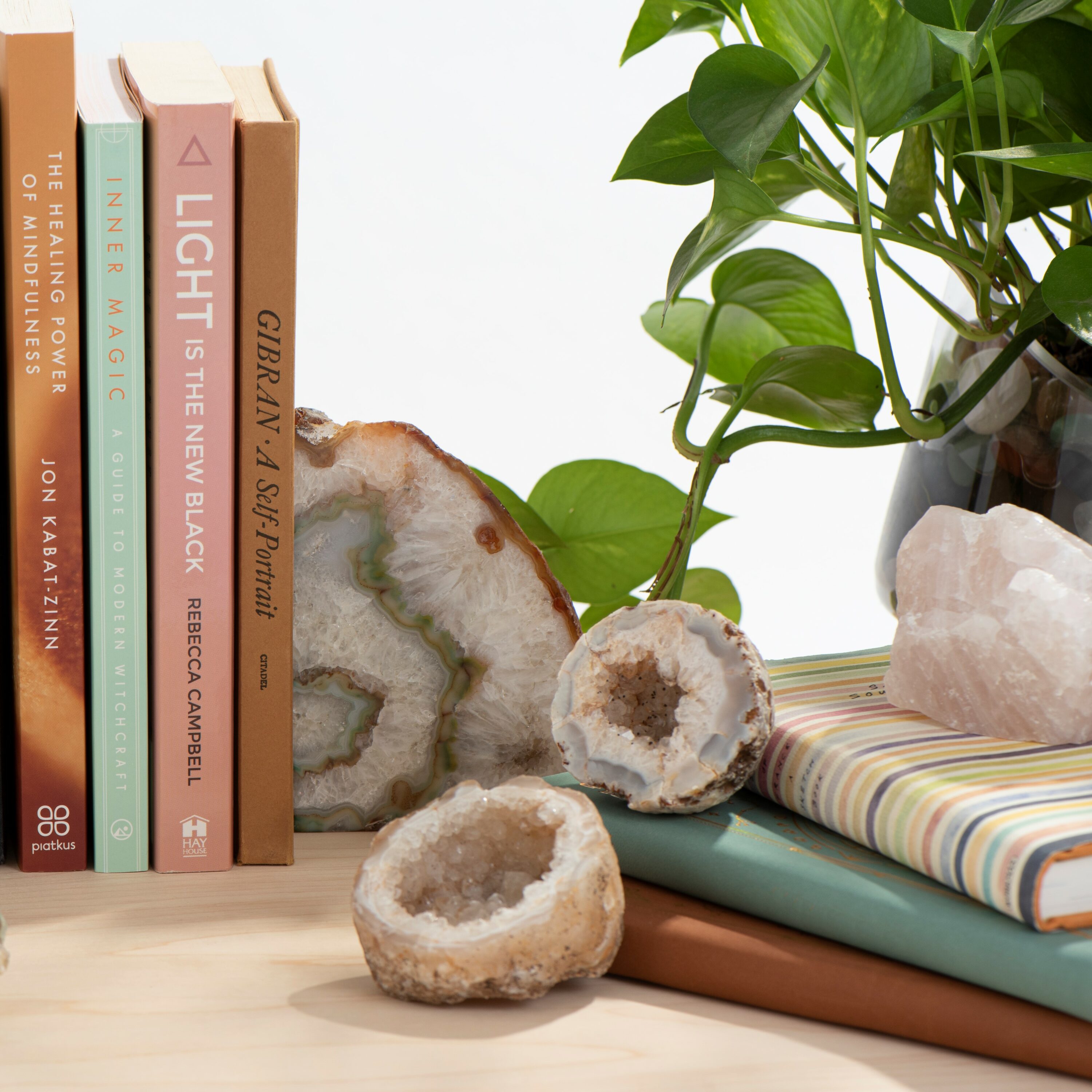a homescape evoking sanctuary with bookends, geodes, and books