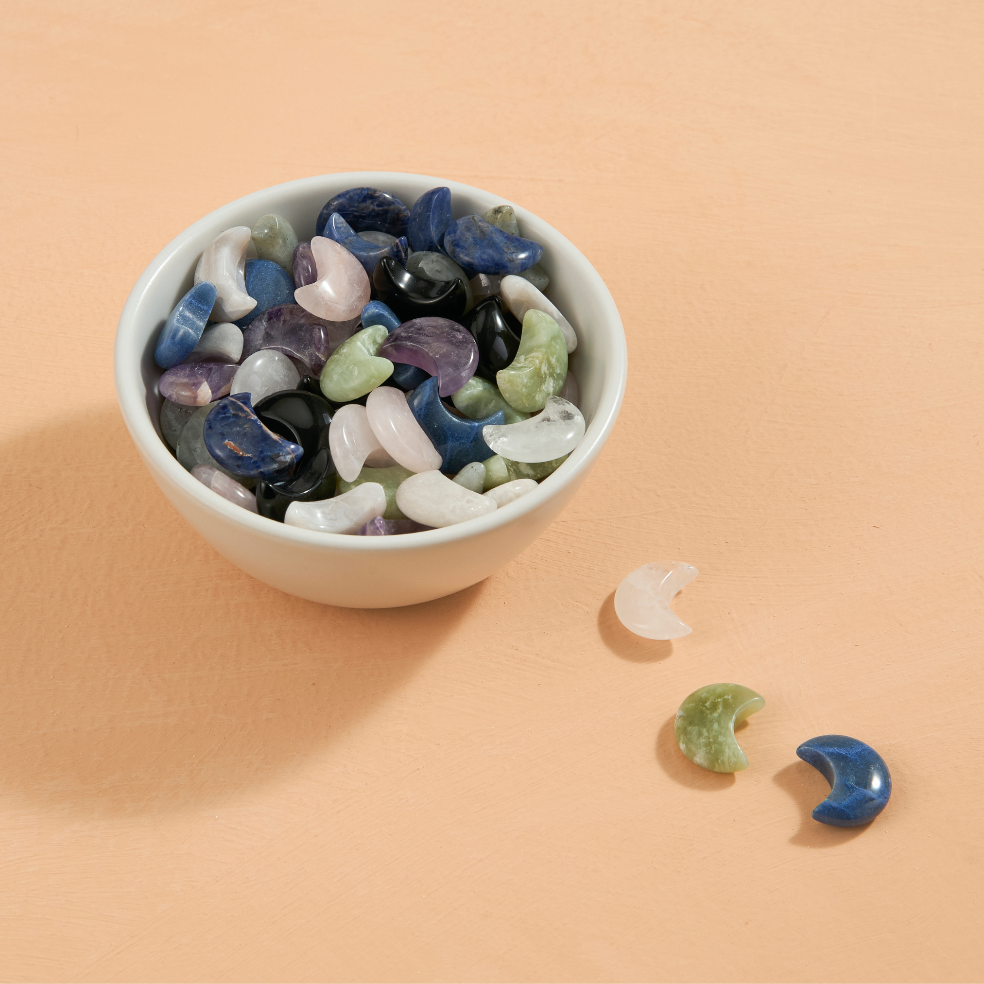 bowl full of a unit of wholesale assorted carved mini crystal moons