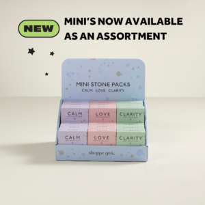 a wholesale display of 18 mini boxed crystal collections: Calm, Love, Clarity. With text: NEW Mini's now available as an assortment.