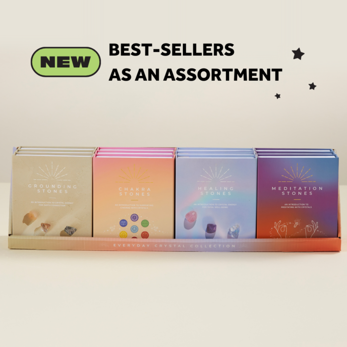 a wholesale display of 12 boxed crystal collections: grounding stones, chakra stones, healing stones, and meditation stones. With text: NEW Best-sellers as an assortment.