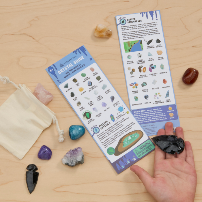 wholesale kid's crystal guide with loose crystals and a child's hand