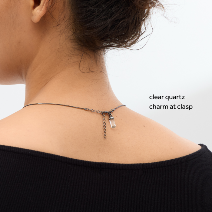 wholesale clear quartz necklace on a pewter chain on a woman's neck