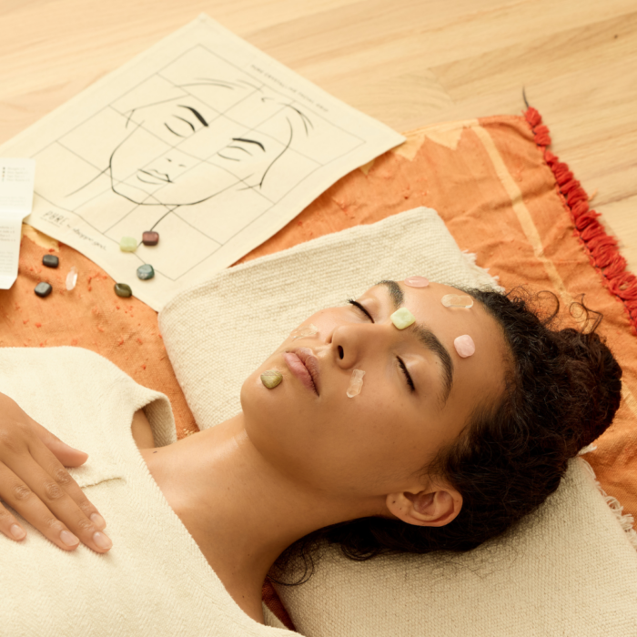 wholesale crystal facial grid on the face of a woman lying with her eyes closed in a home spa setting