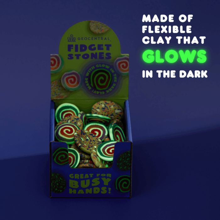 wholesale fidget stones in a purple and green display in low lighting with the text "made of flexible clay that glows"