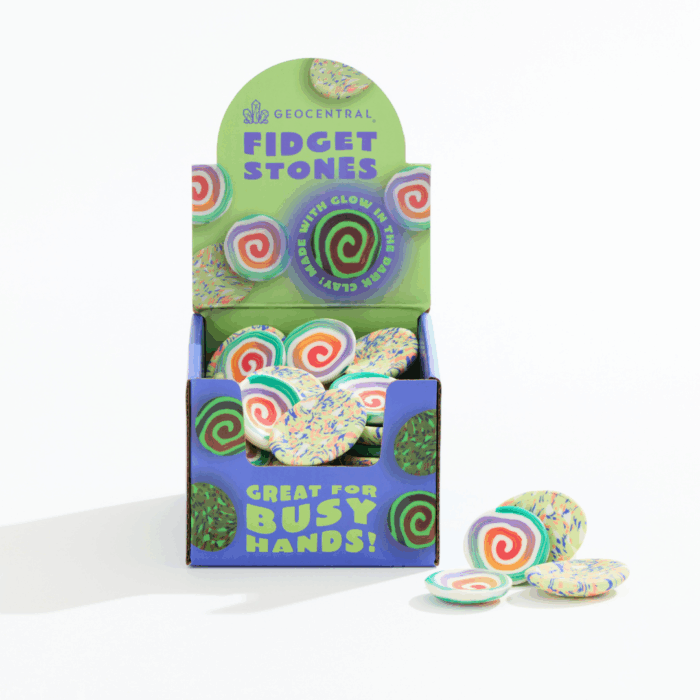 wholesale fidget stones in a purple and green display. the display has the text "great for busy hands!" and "Made with glow in the dark clay!"