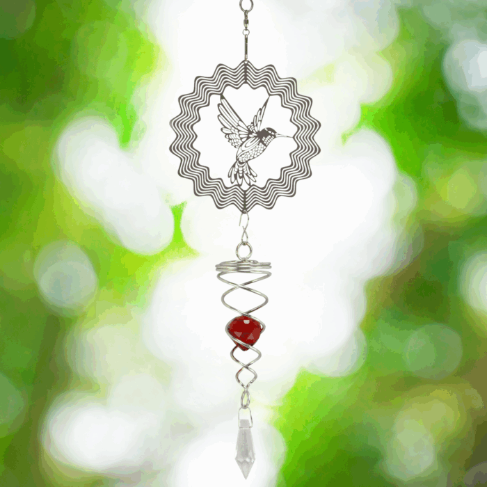 Wholesale hanging garden decor - silver wind spinner on blurred outdoor background