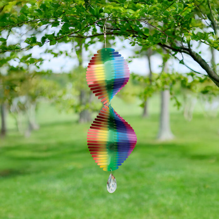 Wholesale hanging garden decor - multicolored wind spinner on blurred outdoor background