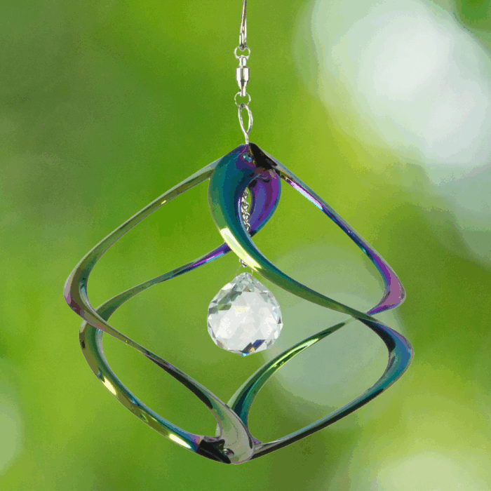 Wholesale hanging garden decor - iridescent wind spinner on blurred outdoor background