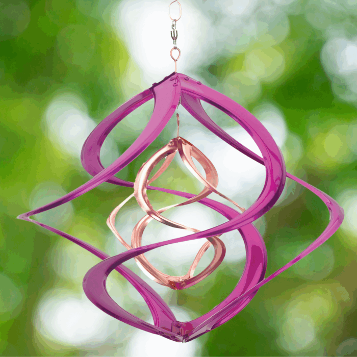 Wholesale hanging garden decor - pink and gold wind spinner on blurred outdoor background