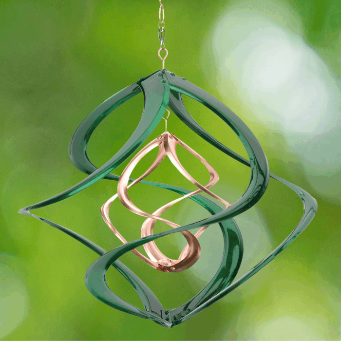 Wholesale hanging garden decor - green and gold wind spinner on blurred outdoor background