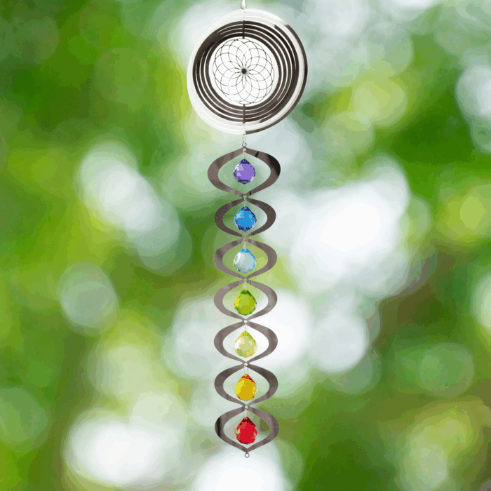 Wholesale hanging garden decor - silver wind spinner on blurred outdoor background