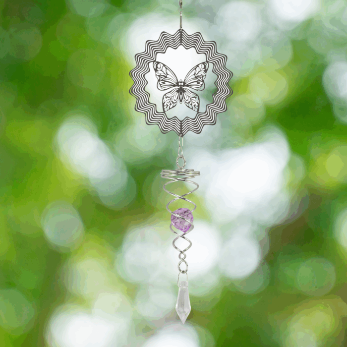 Wholesale hanging garden decor - silver wind spinner on blurred outdoor background