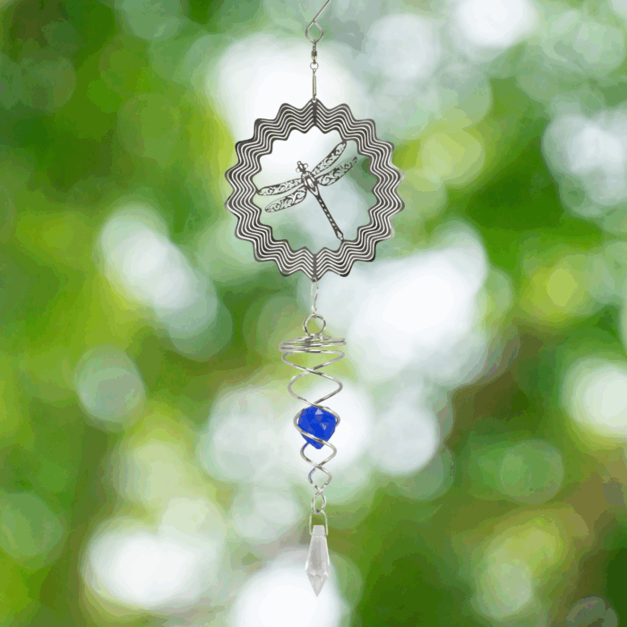 Wholesale hanging garden decor - silver wind spinner on blurred outdoor background