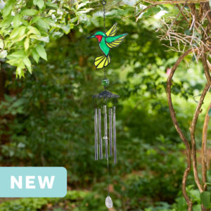 faux stained glass green hummingbird wind chime with silver aluminum chimes and a crystal prism weight hanging outdoors