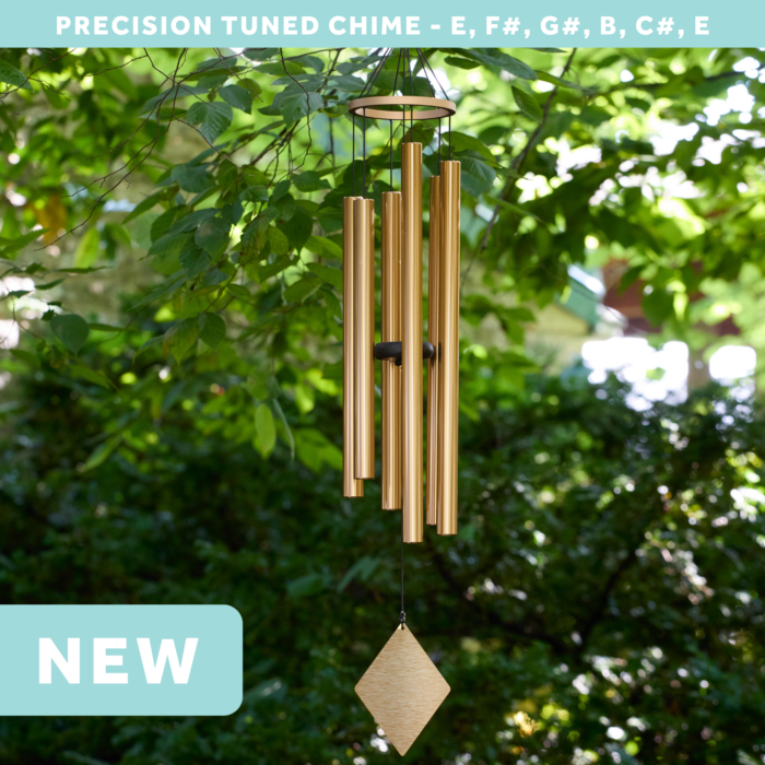 wholesale precision tuned wind chime with a corrosion resistant finish hung outside on a leafy background