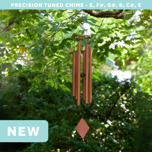 wholesale precision tuned wind chime with a corrosion resistant finish hung outside on a leafy background