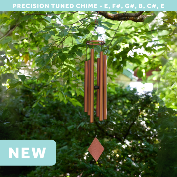 wholesale precision tuned wind chime with a corrosion resistant finish hung outside on a leafy background