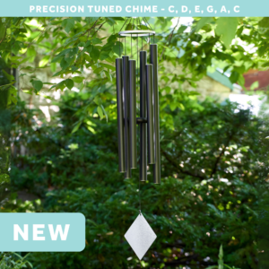wholesale precision tuned wind chime with a corrosion resistant finish hung outside on a leafy background