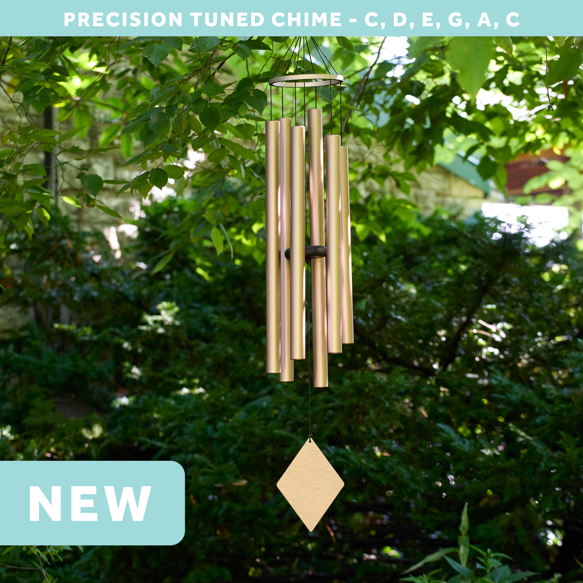 wholesale precision tuned wind chime with a corrosion resistant finish hung outside on a leafy background
