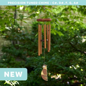 wholesale precision tuned wind chime with a corrosion resistant finish hung outside on a leafy background featuring a wood carved owl as the windsail
