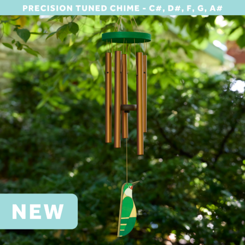 wholesale precision tuned wind chime with a corrosion resistant finish hung outside on a leafy background featuring a wood carved hummingbird as the windsail