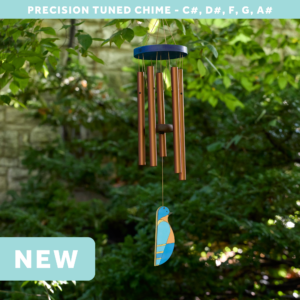 wholesale precision tuned wind chime with a corrosion resistant finish hung outside on a leafy background featuring a wood carved bluebird as the windsail