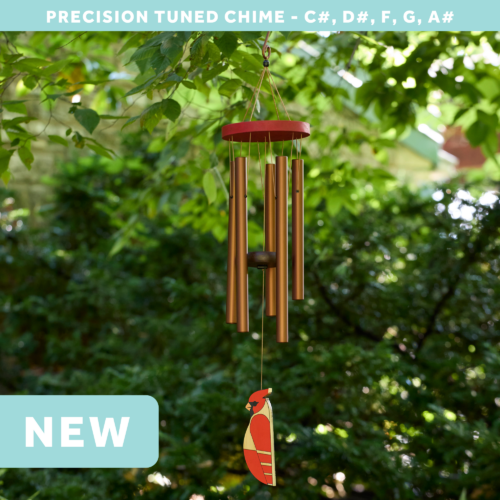 wholesale precision tuned wind chime with a corrosion resistant finish hung outside on a leafy background featuring a wood carved cardinal as the windsail