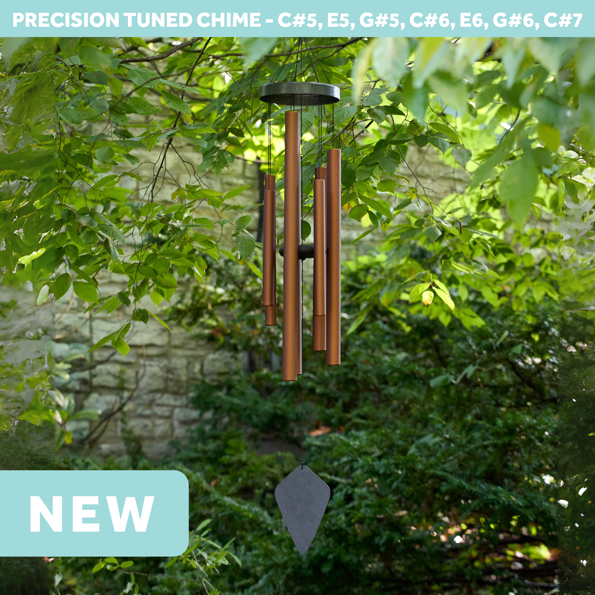 wholesale precision tuned wind chime with a corrosion resistant finish hung outside on a leafy background