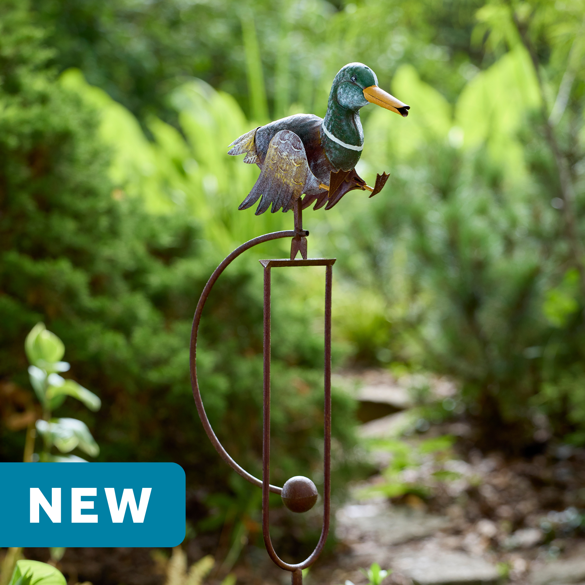 wholesale garden balance rocker featuring a walking mallard duck on a outdoor background with greenery