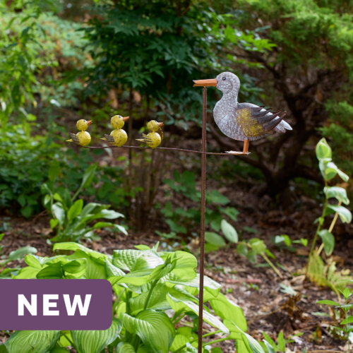 wholesale garden balancer featuring a mother duck and three yellow ducklings on an outdoor background with greenery