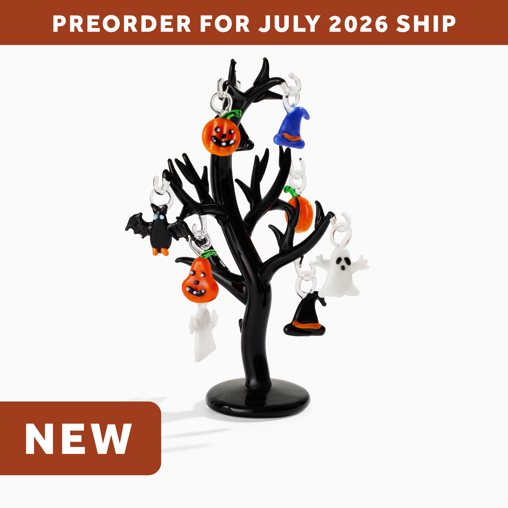 wholesale halloween glass halloween tree with halloween themed ornaments - pumpkins, witch hats, ghosts, and a bat. text says: preorder for july 2026 ship. NEW.