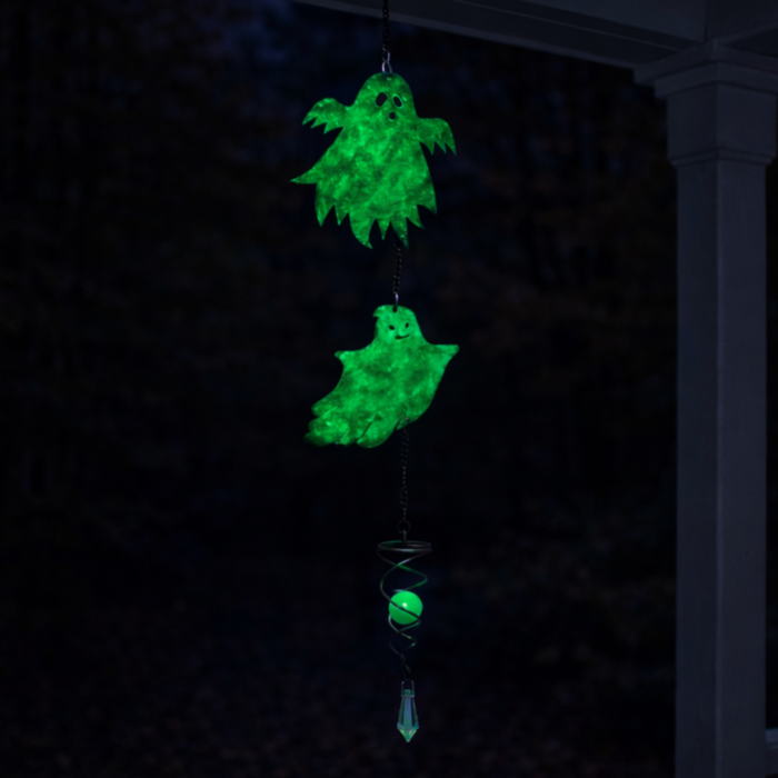 wholesale glow in the dark hanging garden wind spinner featuring 2 friendly ghosts. this is shown glowing in the dark on a white background.